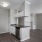 a kitchen with white cabinets