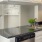 a kitchen with white cabinets