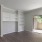 a room with a wood floor and a wood floor with a glass door