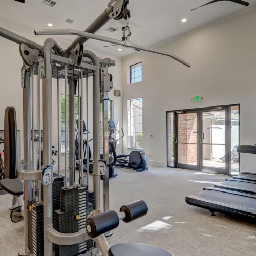Cutting-edge amenities at your fingertips a gym with exercise equipment